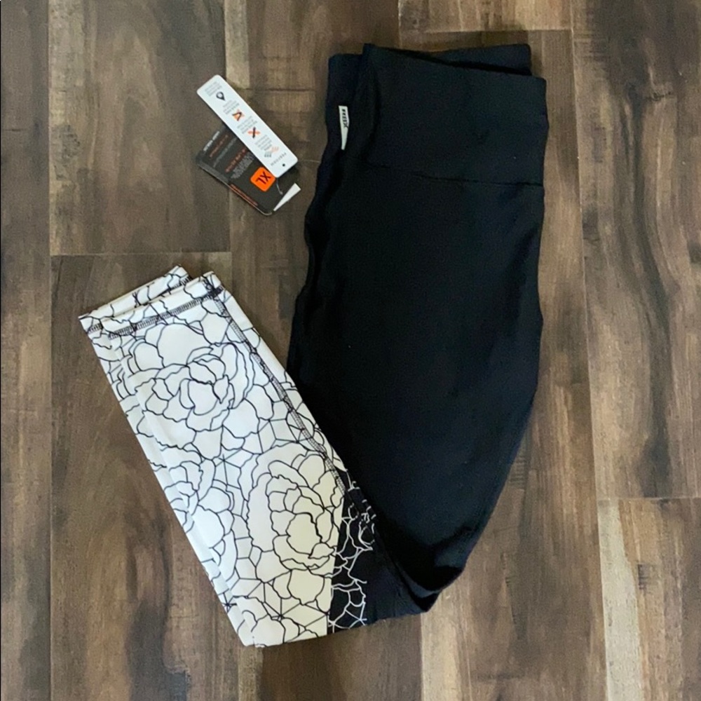 Brand new black leggings with patterned white ends